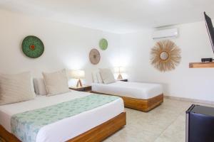 Postel nebo postele na pokoji v ubytování Hotel Isla del Sol
