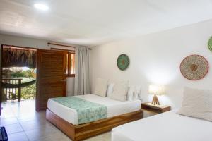 Postel nebo postele na pokoji v ubytování Hotel Isla del Sol