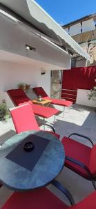 a group of chairs and a table in a room at Old Town Baska in Baška