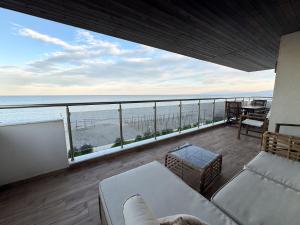 a living room with a view of the ocean at Aqua Mare Luxury Apartments in Paralia Katerinis