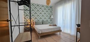 a small bedroom with a bed and a window at Green House in Montesilvano