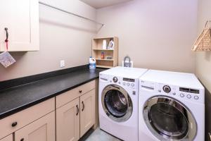 a white washer and dryer in a kitchen at Cozy Cactus Inn in Sedona