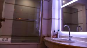 a bathroom with a sink and a shower at Appartement marina agadir in Agadir