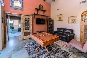 a living room with a pool table and a couch at Cozy Cactus Resort sorta-kinda in Sedona