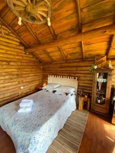 Ένα ή περισσότερα κρεβάτια σε δωμάτιο στο Cabanas Nosso Recanto