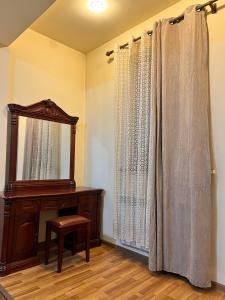 a room with a mirror and a dresser and a mirror at Residence North Avenue, Teryan 8 , apt14 3 in Yerevan
