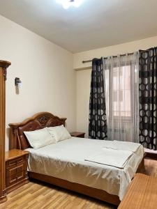 a bedroom with a large bed and a window at Residence North Avenue, Teryan 8 , apt14 3 in Yerevan