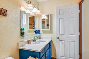 a bathroom with a sink and a mirror at Downtown Williams Home Walk to Shops and Dining! in Williams +16 photos