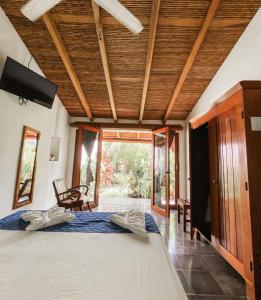 a bedroom with a bed and a large window at Hotel il Padrino in Granada
