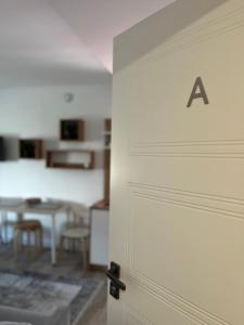 a door with a sign on it in a room at Adventure Base A&B in Stronie Śląskie +14 photos