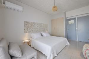 Кровать или кровати в номере CICADA HOTEL