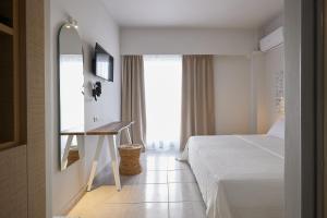 Кровать или кровати в номере CICADA HOTEL