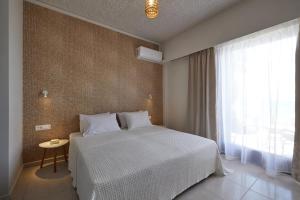 Кровать или кровати в номере CICADA HOTEL