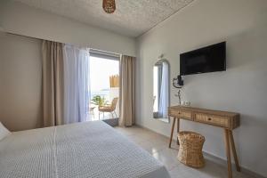 Телевизор и/или развлекательный центр в CICADA HOTEL