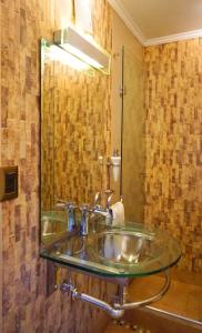 a bathroom with a sink and a mirror at Portugal L y D in Santiago