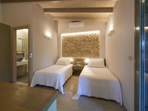 Кровать или кровати в номере CICADA HOTEL