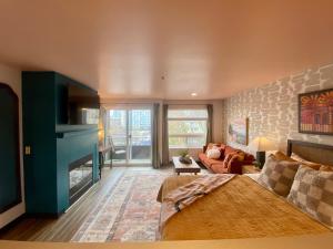 a bedroom with a bed and a living room at Quest Travels in Seattle