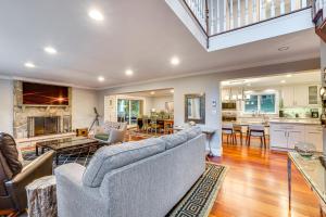 a large living room with a couch and a kitchen at Briarcliff Manor Estate with Hudson River Views in Briarcliff Manor