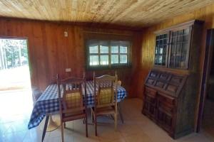 a dining room with a table and chairs at Finca Cottage Guarne, nearby Arvi and Santa Elena in Guarne