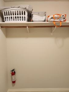 a shelf with a radiator and other items on it at Peaceful suite near the lake in Victoria