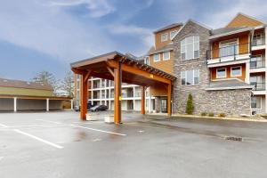 a parking lot in front of a building at Riverfront Retreat in Seaside