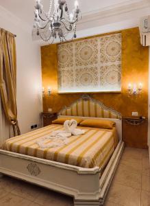 a bedroom with a bed with towels on it at Casa belvedere luxury in Anzio