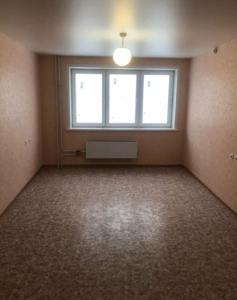 an empty room with a window and a fan at Apartment big home in La Ricamarie