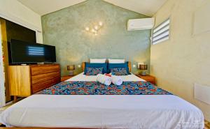 Postel nebo postele na pokoji v ubytování Appart T2 - Jacuzzi gonflable et accès plage