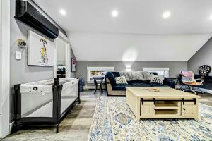 a living room with a couch and a table at Luxury Spa Chalet in Greenwood