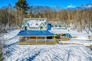 an aerial view of a house in the snow at Bryant Pond Chalet in Greenwood