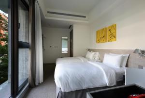 Letto o letti in una camera di CityInn Hotel Plus- Fuxing North Road Branch