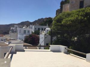 a view of a town with white buildings at School House with Panoramic View in Serifos Chora +23 photos
