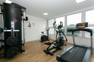 a gym with two treadmills and two exercise bikes at PC4008 - Apto moderno Tatuapé in Sao Paulo