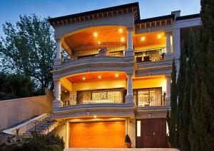 a large white house with a large garage at 59 Lakeside Luxury Views 2br 2baparking in Perth
