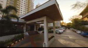 a view of a building with cars parked in a parking lot at Mesaverte Residences "ZACE STUDIO" in Cagayan de Oro