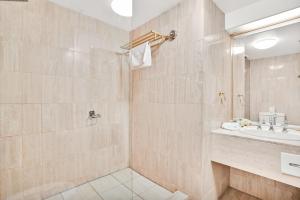 a bathroom with a sink and a shower at Carlton Lygon Lodge - Close to Melbourne Uni in Melbourne +39 photos