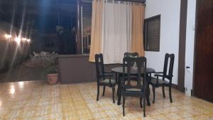 a dining room table and chairs in a room at Hotel Sansivar in El Venado