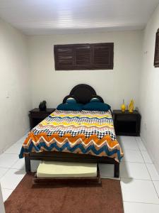 A bed or beds in a room at Casa Sítio Beija Flor