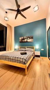 Un pat sau paturi într-o cameră la Cozy Aera Residence / FREE Wi-fi Netflix / Sunway