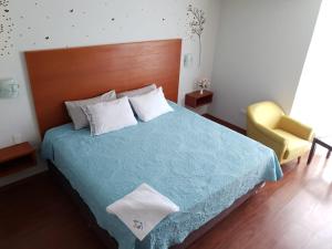 Postel nebo postele na pokoji v ubytování Hotel Florez Boutique + 19 fotografií