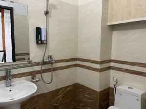 a bathroom with a toilet and a sink at Nhật's Sapa Central Hostel in Sapa +69 photos