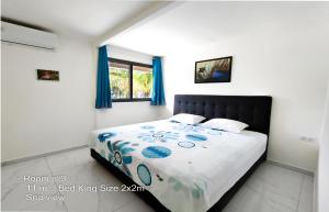 Postel nebo postele na pokoji v ubytování Blue Lagoon Villa