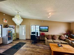 a living room with a couch and a table at Knights Inn Bridgeport Frankenmuth in Bridgeport