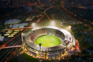 an aerial view of a baseball stadium at night at A Chic & Comfy 2BR Apt Near Federation Square in Melbourne