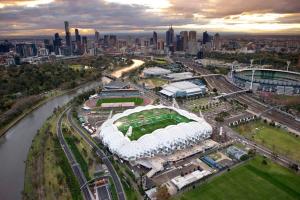 an aerial view of a soccer stadium with a city at A Chic & Comfy 2BR Apt Near Federation Square in Melbourne