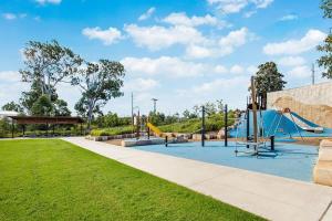 a park with a playground with a slide at Aircabin - Cobbitty - Lovely - 5 Beds House in Cobbitty