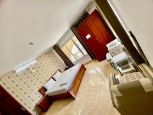 Postel nebo postele na pokoji v ubytování Nhat Hoang Hotel