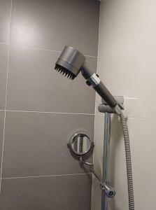 a blow dryer in a shower in a bathroom at Sukhumvit Soi 10 Stay in Style in Khlong Toei