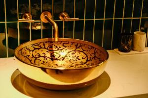 a bowl sitting on top of a counter at Xinyu Hotel - Shanghai Jiao Tong University Xinhua Road in Shanghai