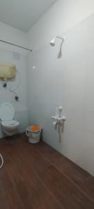 a bathroom with a toilet and a sink at cg residency in Puducherry